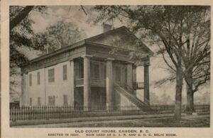sepia photo of classic two story building. "Old Court House Camden, S.C. Erected in 1820. Now used as D.A.R. and U.D.C. Relic Room"