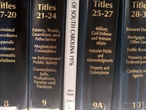 closeup of Titles 21-24 and 25-27 of the South Carolina Code, with a paperback supplement between them