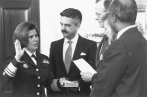 Surgeon General Antonia Novello is sworn in by President Bush, as her husband, Dr. Joseph Novello, holds the Bible, March 9, 1990.